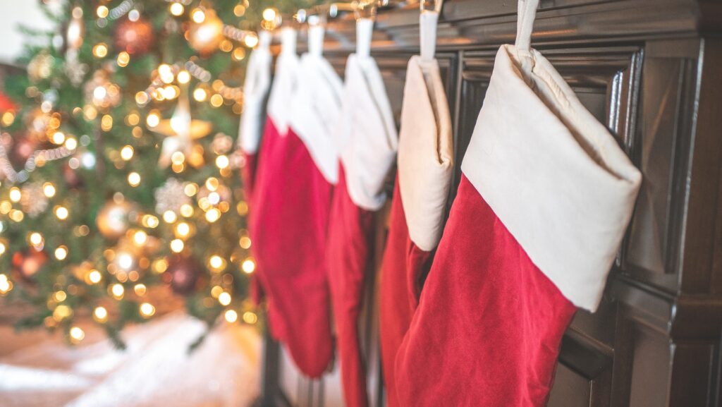 Christmas stockings hung next to tree