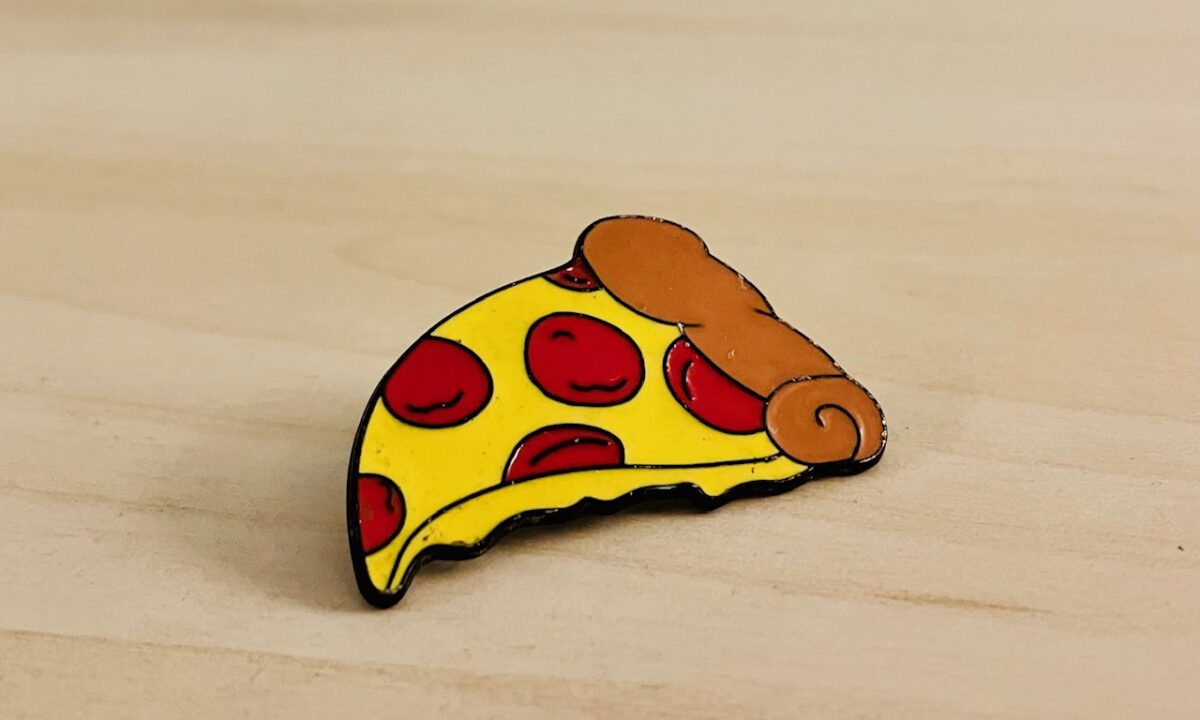 life is sometimes like a pizza lapel pin stuck in your bare foot