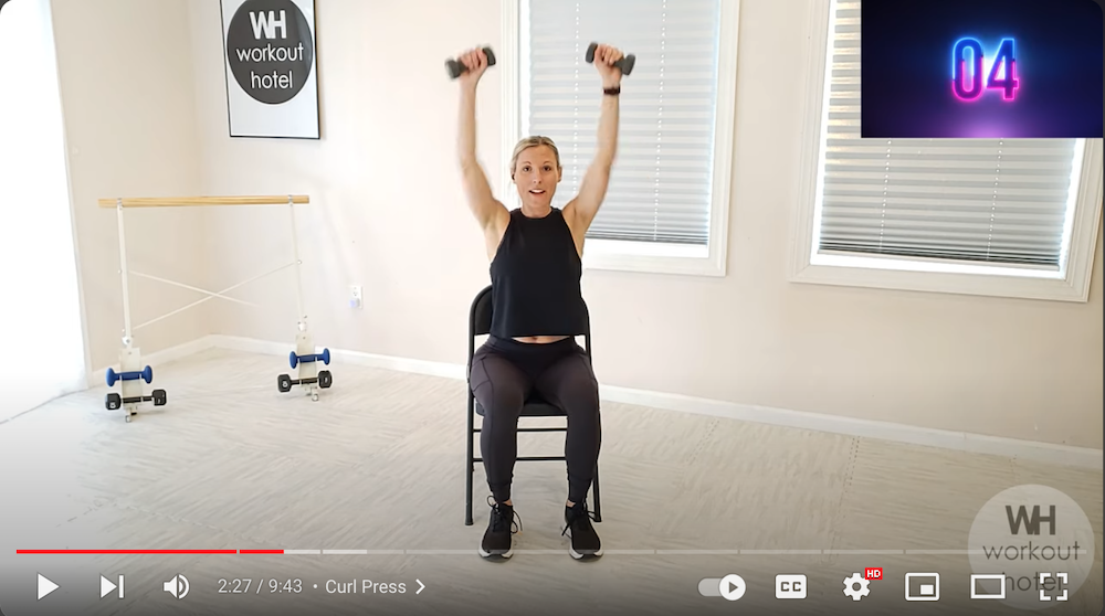 YouTube screenshot from Workout Hotel's video Seated Chair Workout for Upper Body Strength