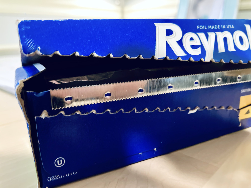 close-up photo of the built-in teeth of an aluminum foil roll